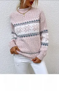 Detail view of pink Fair Isle knit sweater with snowflake patterns and mock neck collar
