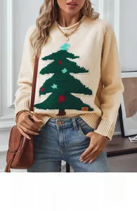 Close-up of beige Christmas tree knit sweater with festive pattern and soft texture