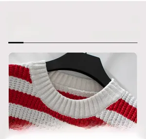 Detail showing the round neckline and striped chenille knit texture of the sweater