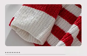 Close-up of red and white striped knit sweater cuff showing thick chenille texture
