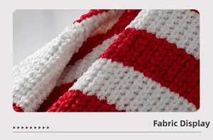 Macro view of soft red and white striped knit fabric with plush chenille texture