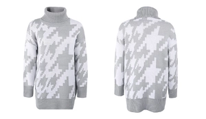 Détails du tricot et poignets côtelés sur un pull à motifs géométriques gris et blanc