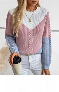 Detail of color-block cable knit sweater with white, pink and blue textured stitch