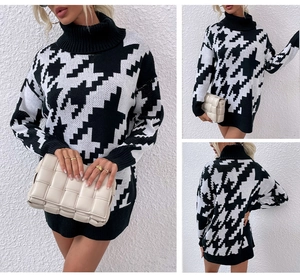 Détail de robe en tricot à col montant et manches longues avec motif pied-de-poule