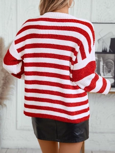 Women's red and white striped chenille sweater in loose knit style from back view