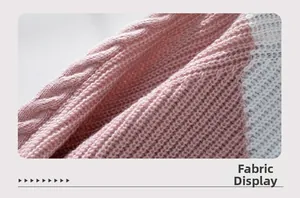 Close-up of pink and white color-block cable knit fabric texture for winter sweaters