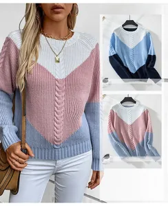 Detail of chunky cable-knit pattern and V-shape color block design on women sweater