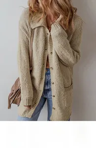Detail of oatmeal knit cardigan with front buttons, lapel collar and side pockets