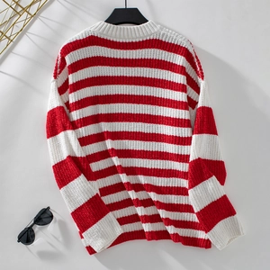 Close-up of red and white striped chenille knit sweater showing soft texture and crewneck