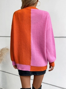 Women's loose color-block knit sweater in bright orange and pink with long sleeves