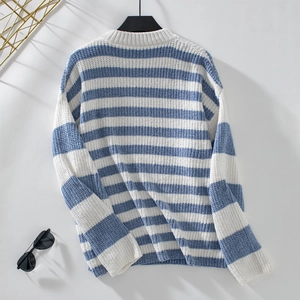 Close-up of blue and white striped chenille sweater showing thick knit texture details