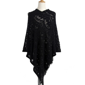 Women's bohemian black hollow-out crochet knit poncho sweater with long tassel hem detail