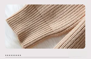 Detailed close-up of ribbed cuffs on khaki knit cardigan sweater with textured finish