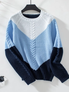 Detail of cable-knit pattern on the three-color patchwork pullover sweater for women