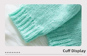 Close-up of ribbed cuffs on a mint green knit cardigan with soft texture detail