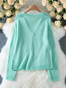 Chic light mint green V-neck knit cardigan with button closure for casual wear