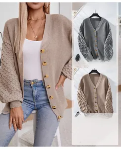 Detail of V-neck knitted cardigan with waffle texture sleeves and button closure