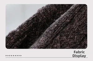 Detailed view of the coarse dark knit fabric with soft texture and premium feel