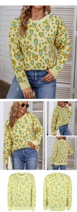 Detail of knit sweater with leopard heart print showing ribbed cuffs and neckline