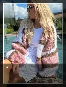 Close-up of pink and white striped knit cardigan with soft mohair texture and lantern sleeves