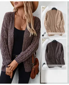 Macro view of cable knit texture and V-neck design on long sleeve oversized cardigan