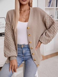 Chic beige V-neck knit cardigan with textured bubble sleeves and wooden buttons