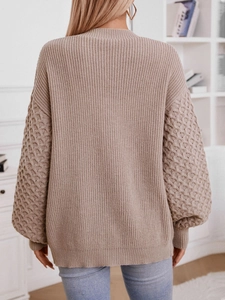 Oversized khaki knitted sweater with textured puff sleeves and loose fit style
