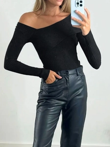 Elegant off-shoulder black ribbed sweater with crossed neckline and slim fit silhouette