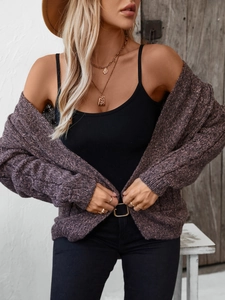 Detail of chunky cable knit texture on a mauve open-front cardigan for women