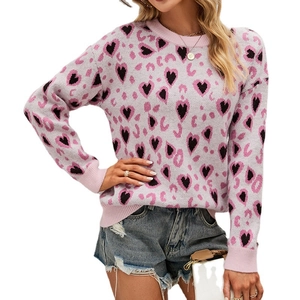 Pink knit sweater with contrasting black hearts and dark pink patterns for women