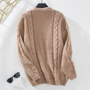 Detailed view of khaki chunky knit sweater with intricate cable patterns and long sleeves