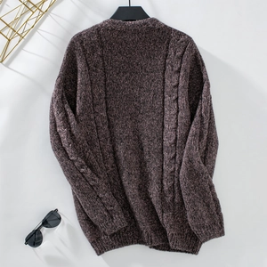 Macro detail of purplish brown cable knit texture and classic chunky stitching patterns