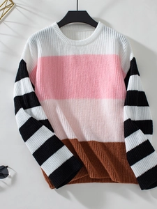 Detail of color-block knit sweater featuring pink and brown stripes with striped sleeves
