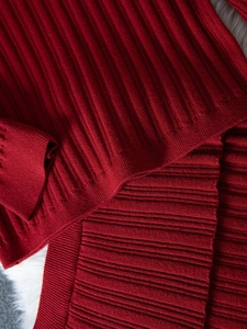 Detailed close-up of the red ribbed knit texture and premium stitching of the elegant set