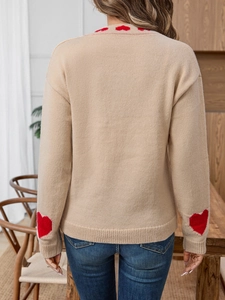 Elegant women sweater with red heart patterns and tie-front detail shown from back view