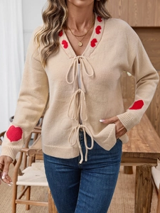 Elegant beige heart pattern knit cardigan with front tie closure and long sleeves