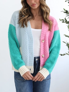 Women's color block knit cardigan with pastel patchwork panels and amber buttons