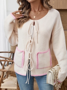 Women contrast knit cardigan in beige with pink trim and front tie closure