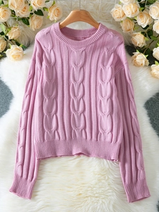 Pink chunky cable knit sweater for women with round neck and ribbed cuffs in soft aesthetic
