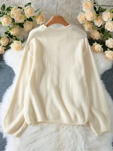 Chic cream cable knit sweater for women featuring a crew neck and ribbed cuffs