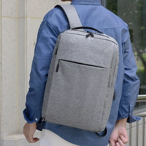 Water-resistant grey business backpack with USB port for commuting and laptop storage