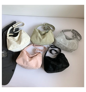 Detailed collection of crescent tote bags in white, green, grey, pink, and black colors