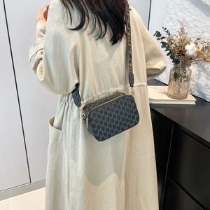 Women's grey crossbody bag with M-pattern print and stylish wide woven shoulder strap