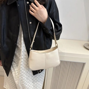 Chic cream-colored minimalist underarm bag in premium faux leather for summer outfits