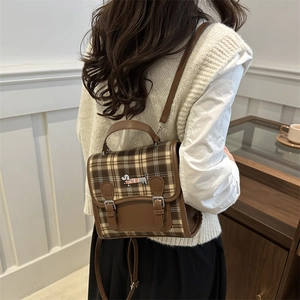 Retro plaid backpack for women featuring a brown dachshund patch and vintage buckle straps
