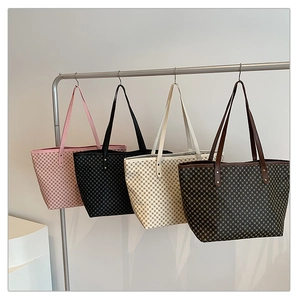 Close-up of four checkered tote bags in pink, black, cream, and coffee colors on hangers