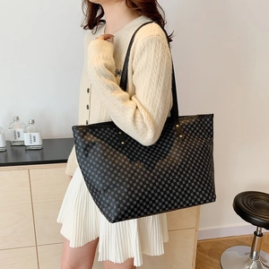 Chic dark grey tote bag with geometric circle pattern and black shoulder straps