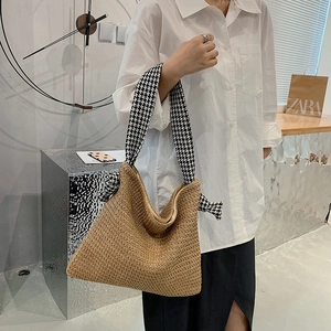 Straw woven tote bag with a stylish black and white houndstooth fabric wide strap