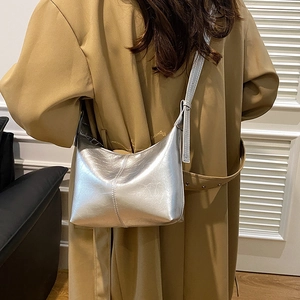 Silver crescent shoulder bag with metallic wrinkled texture and chic hobo moon shape