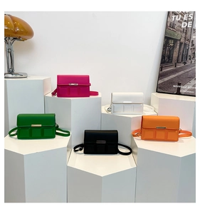 Detail of colorful mini square crossbody bags with chocolate texture and gold metal buckle